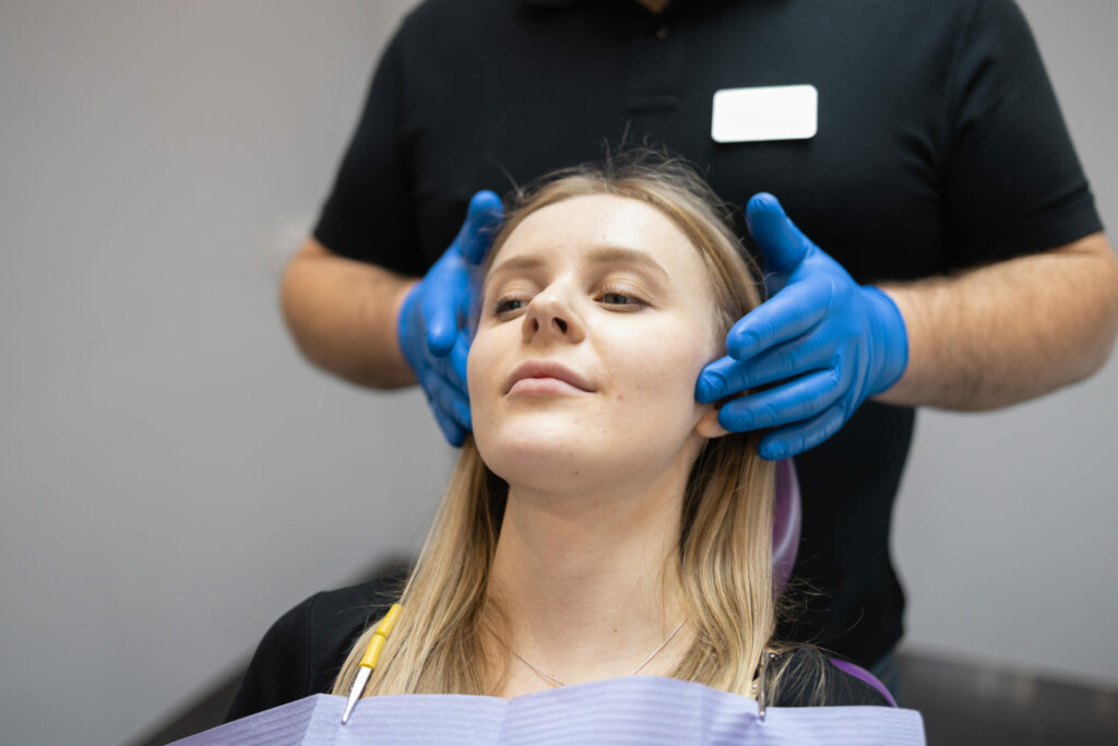 woman getting a consultation at an oral surgeon