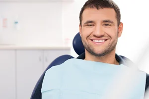 A man smiling as he gets ready for his oral surgery